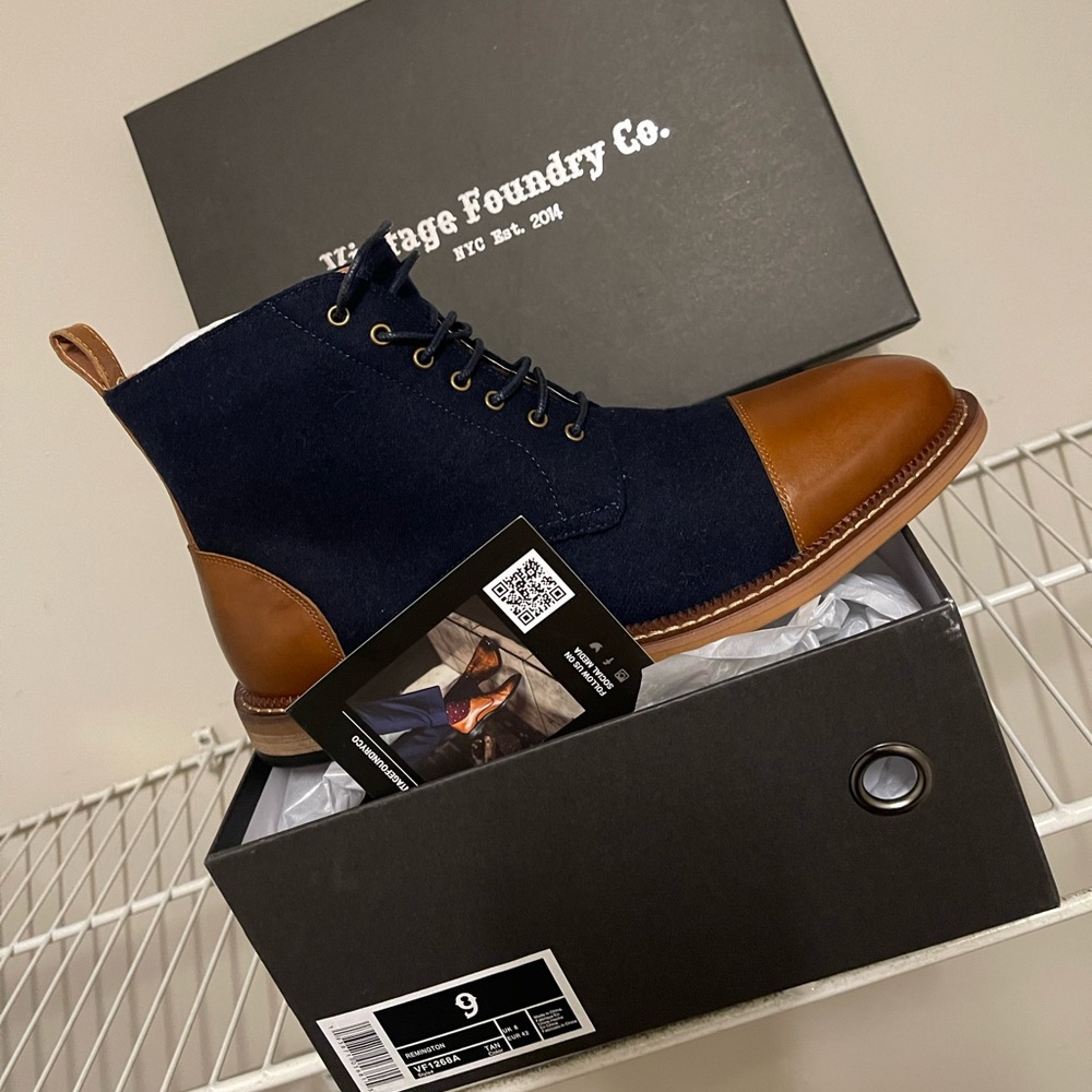 Blue denim boot with brown toe and heel designed by Vintage.